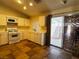 Well-lit kitchen featuring white appliances and ample counter space; easy access to backyard at 5512 Oakwood Ridge St, Las Vegas, NV 89130