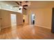 Generously-sized bedroom with vaulted ceiling, ceiling fan, hard flooring, and bathroom access at 5512 Oakwood Ridge St, Las Vegas, NV 89130