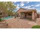 Fully landscaped backyard with pool, covered patio, desert landscaping, and block wall for privacy at 5588 La Sendas Ct, Las Vegas, NV 89122