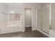 Bathroom featuring a soaking tub and separate glass enclosed shower at 5588 La Sendas Ct, Las Vegas, NV 89122