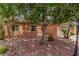 Charming single-story home featuring a well-maintained yard, mature tree, and a two-car garage at 5588 La Sendas Ct, Las Vegas, NV 89122