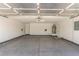 Spacious two car garage with epoxy floors, water heater, door to inside of house, and garage door opener at 5588 La Sendas Ct, Las Vegas, NV 89122