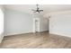 Bright, open living space with wood-look flooring, high ceilings, and neutral paint at 5588 La Sendas Ct, Las Vegas, NV 89122