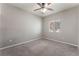 Bedroom with carpet, ceiling fan, and window at 5844 Gushing Spring Ave, Las Vegas, NV 89131