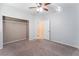 Neutral bedroom with carpet, ceiling fan, and closet at 5844 Gushing Spring Ave, Las Vegas, NV 89131