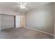Bedroom with carpet, ceiling fan, and sliding door closet at 5844 Gushing Spring Ave, Las Vegas, NV 89131