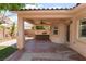 A covered patio features a built-in grill and ample space for seating at 5844 Gushing Spring Ave, Las Vegas, NV 89131