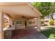 Covered patio featuring a built-in grill and ceiling fan for outdoor entertaining at 5844 Gushing Spring Ave, Las Vegas, NV 89131