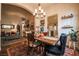 Bright dining area showcasing a chandelier and access to the kitchen at 5844 Gushing Spring Ave, Las Vegas, NV 89131