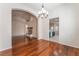 A dining room featuring hardwood floors, a fireplace, and a chandelier at 5844 Gushing Spring Ave, Las Vegas, NV 89131