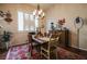 Cozy dining room featuring plantation shutters and classic decor at 5844 Gushing Spring Ave, Las Vegas, NV 89131