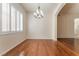 Inviting dining room with hardwood floors, chandelier, and natural light at 5844 Gushing Spring Ave, Las Vegas, NV 89131