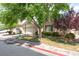Charming single-story home with a two-car garage, For Sale sign and mature landscaping at 5844 Gushing Spring Ave, Las Vegas, NV 89131