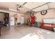 Spacious garage with epoxy floors, storage, and ample space for parking and hobbies at 5844 Gushing Spring Ave, Las Vegas, NV 89131