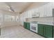 Bright kitchen features tile floors, island, and modern appliances at 5844 Gushing Spring Ave, Las Vegas, NV 89131
