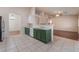 Spacious kitchen shows an island counter space and open view to dining area at 5844 Gushing Spring Ave, Las Vegas, NV 89131