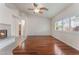 Open-concept living room with hardwood floors, fireplace and combined bathroom at 5844 Gushing Spring Ave, Las Vegas, NV 89131