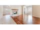Open floorplan living room featuring hardwood floors and a fireplace at 5844 Gushing Spring Ave, Las Vegas, NV 89131