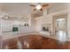 Open-concept living room with hardwood floors, fireplace and combined kitchen at 5844 Gushing Spring Ave, Las Vegas, NV 89131