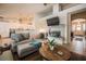 Inviting living room featuring tile flooring, a fireplace, and comfortable seating arrangements at 5844 Gushing Spring Ave, Las Vegas, NV 89131