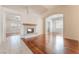 Open floorplan living room featuring hardwood floors and a fireplace at 5844 Gushing Spring Ave, Las Vegas, NV 89131