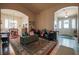 Spacious living area with tile floors, arched doorways, and abundant natural light at 5844 Gushing Spring Ave, Las Vegas, NV 89131