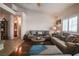 Relaxing living room with hardwood floors, neutral colors, and plantation shutters at 5844 Gushing Spring Ave, Las Vegas, NV 89131
