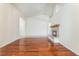 Spacious living room with hardwood floors and a cozy fireplace at 5844 Gushing Spring Ave, Las Vegas, NV 89131