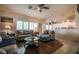 Bright living room with plantation shutters and an open concept design, adjacent to kitchen at 5844 Gushing Spring Ave, Las Vegas, NV 89131