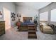 Spacious bedroom with carpet, seating and large windows at 5844 Gushing Spring Ave, Las Vegas, NV 89131