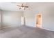 A spacious main bedroom featuring high ceilings and carpeted floors at 5844 Gushing Spring Ave, Las Vegas, NV 89131