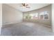 A spacious main bedroom with three large windows at 5844 Gushing Spring Ave, Las Vegas, NV 89131