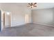 A spacious main bedroom featuring high ceilings and carpeted floors at 5844 Gushing Spring Ave, Las Vegas, NV 89131
