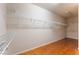Spacious walk-in closet with wood floors and wire shelving for ample storage at 5844 Gushing Spring Ave, Las Vegas, NV 89131