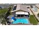 Aerial view of a property with a pool, putting green, and covered patio, showcasing outdoor living at its finest at 5852 Ireland Ridge Ct, Las Vegas, NV 89149