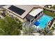 Aerial view of a home with a pool, putting green, and covered patio, offering an exceptional outdoor living experience at 5852 Ireland Ridge Ct, Las Vegas, NV 89149