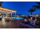 Relaxing backyard with a sparkling pool, cozy fire pit, and comfortable seating area at 5852 Ireland Ridge Ct, Las Vegas, NV 89149