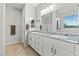 Bright bathroom featuring double sinks, large mirror and plenty of counter space at 5852 Ireland Ridge Ct, Las Vegas, NV 89149