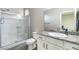 Bathroom featuring glass-enclosed shower and vanity with granite countertop at 5852 Ireland Ridge Ct, Las Vegas, NV 89149