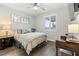 Cozy bedroom with wood floors, window with shutters, and modern decor at 5852 Ireland Ridge Ct, Las Vegas, NV 89149