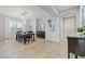 Formal dining room boasting modern lighting, hardwood table and chairs and view to the front door at 5852 Ireland Ridge Ct, Las Vegas, NV 89149