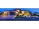 Attractive home showcasing a well-manicured yard, three-car garage, and inviting facade, set against a serene neighborhood backdrop at 5852 Ireland Ridge Ct, Las Vegas, NV 89149