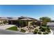 Beautifully landscaped home with a three-car garage, mature trees, and well-maintained yard, creating a welcoming ambiance at 5852 Ireland Ridge Ct, Las Vegas, NV 89149