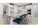 Modern kitchen with a large island, stainless steel appliances, and sleek white cabinets at 5852 Ireland Ridge Ct, Las Vegas, NV 89149