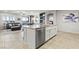 Well-lit kitchen with modern appliances and an island, flowing into a comfortable living area at 5852 Ireland Ridge Ct, Las Vegas, NV 89149