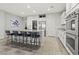 Bright kitchen featuring a large island, modern appliances, and ample counter space at 5852 Ireland Ridge Ct, Las Vegas, NV 89149