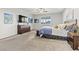 Spacious main bedroom featuring ceiling fan, shutters and cozy carpet and warm decor at 5852 Ireland Ridge Ct, Las Vegas, NV 89149