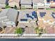 Aerial view of home with solar panels and a paver driveway in a residential neighborhood at 600 Suncrest Peak Pl, Henderson, NV 89011