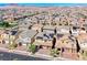 Wide angle aerial view showcases a large neighborhood with mountain views at 600 Suncrest Peak Pl, Henderson, NV 89011