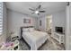Cozy bedroom with a ceiling fan, plush carpet, and a clean, modern aesthetic at 600 Suncrest Peak Pl, Henderson, NV 89011